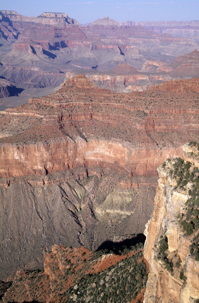 our-story Breathtaking aerial view showcasing the rugged beauty of the Grand Canyon's rock formations and valleys.