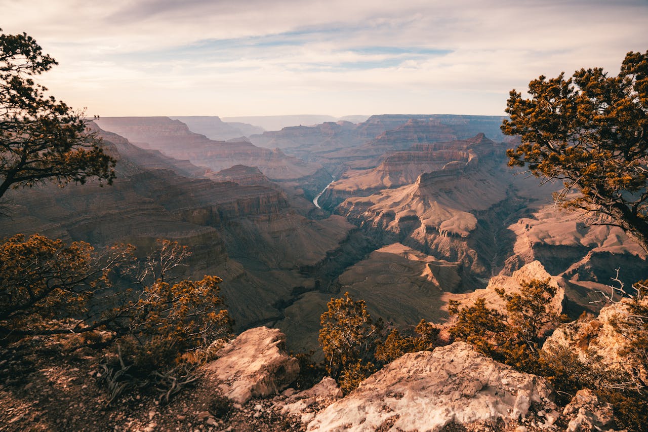 Stunning sunset over the Grand Canyon showcasing rocky formations and vibrant sky.